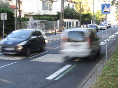 Car speeding on cycleway lane