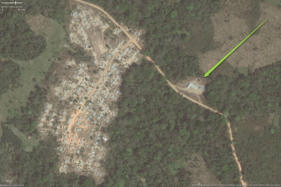 A typical rural school in West Africa. This zoomed out view shows a likely school on the eastern side of the village. While the buildings are not the very classic two long buildings, the overall placement helps to determine this is a school as will the detailed views below. The overall school property should be tagged with amenity=school and I would also put fixme=confirm on this one as well.