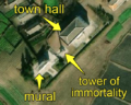 5/7 City centre concentrating a mural (artwork_type=mural and tourism=artwork), a tower of immortality (historic=memorial and memorial=immortality_tower), with its shadow cast on the ground, and a city hall (amenity=townhall) (Maxar satellite imagery)