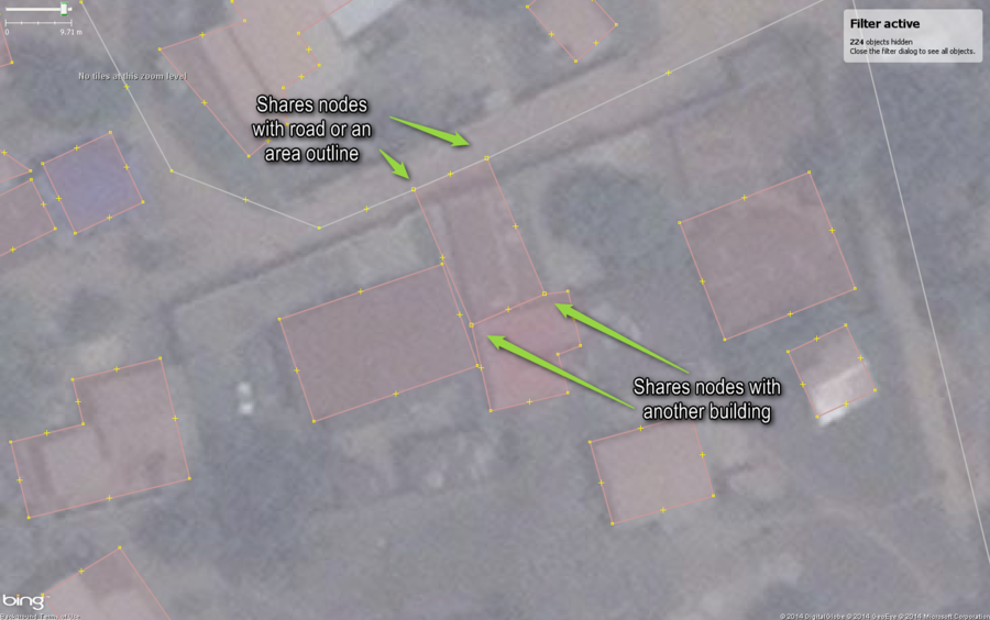 Typical buildings in West African city mapped with a common mistake, shared nodes with some annotations.