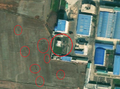 4/4 Substation (power=substation) with many poles around and small shadows in its enclosure (Maxar satellite imagery).