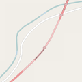 OSM Carto draws tunnels on highways with dotted outlines and a lighter fill colour for the road and with curved colour transitions on tunnel entrances.
