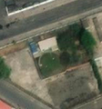 4/5 Covered reservoir (man_made=reservoir_covered) round-shaped, along the road, in the middle of a dense urban area in Pyongyang (Maxar satellite imagery).