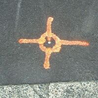 A pin in the surface of a road, used as a geodetic survey marker