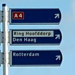 The older/traditional signposting style for ring routes renders Ring Hoofddorp as a local destination, separately from any road number (here A 4). Add name=Ring Hoofddorp and noref=yes to the ring route relation.