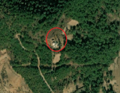 4/6 Communication tower (man_made=tower and tower:type=communication), with an antenna and a small building, on top of a plain (Maxar satellite imagery).