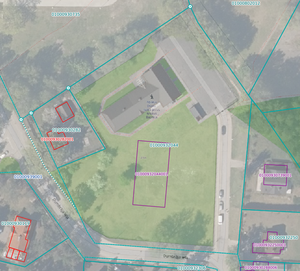 Overlay of an orthophoto, cadastral map and OSM showing an example of a building polygon in cadastre containing an address point not located at the actual place.