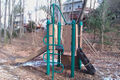 playground=slide; climbingframe Play structure with climbing frame, slide, and steps