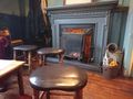 Small coal fire (with fireguard) in a pub