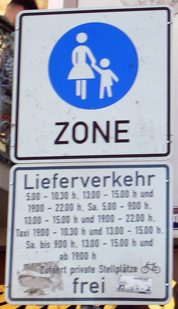 Photo of street signs showing complicated access restrictions to a pedestrianised area