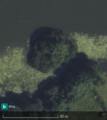 Crannóg at Southern shore of Mill Lough, Co. Cavan. Recognizable as a circular group of trees. https://www.openstreetmap.org/way/1105294164