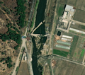 2/6 Dam (waterway=dam) in the middle of a watercourse (Maxar satellite imagery).
