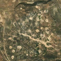 5/8 Disorganized cemetery (landuse=cemetery), without structure on hilly land (Maxar satellite imagery).
