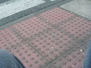 Crossing with flush kerb & tactile paving