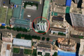 4/4 Storage tank (man_made=storage_tank) in a highly urbanised centre (Maxar satellite imagery).