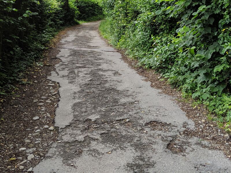 File:Crumbling asphalt path.jpg