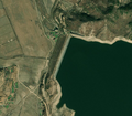 5/6 Dam (waterway=dam) holding back water from a large impoundment (Maxar satellite imagery).